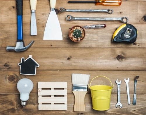 Tools used by Benjamin Handyman Service laid out on a workbench